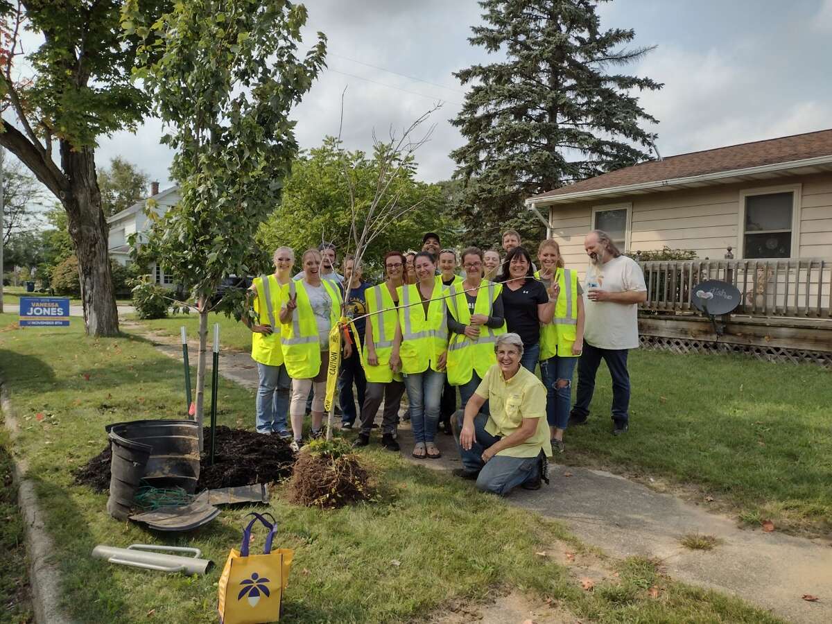Volunteers from the city of Evart, Lume Cannabis Company and the Muskegon River Watershed Assembly completed the final planting to wrap up the Evart tree grant recently. Pictured is city clerk Kathy Fiebig (front) with a group of planters.