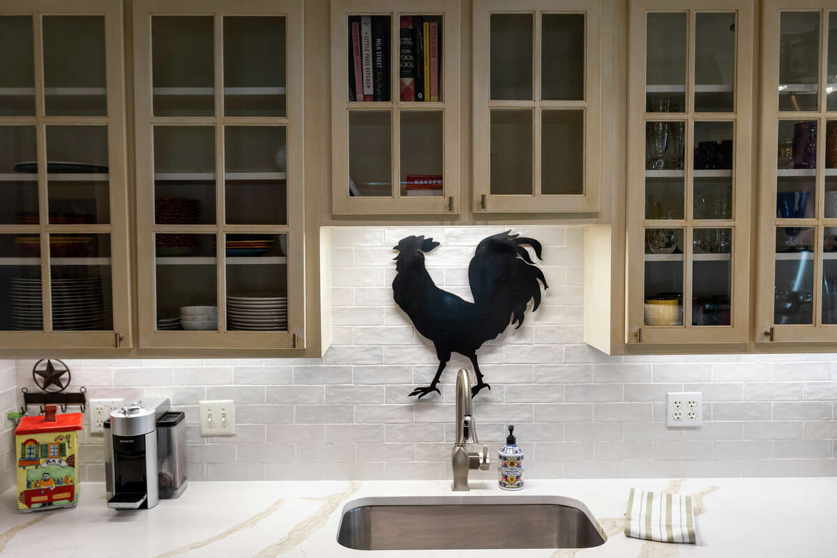 Perhaps the most dramatic bistro-look feature is the Gallic Rooster cutout she hung above the sink. It's a family heirloom that was made by her grandfather and hung in her grandmother's kitchen for years.