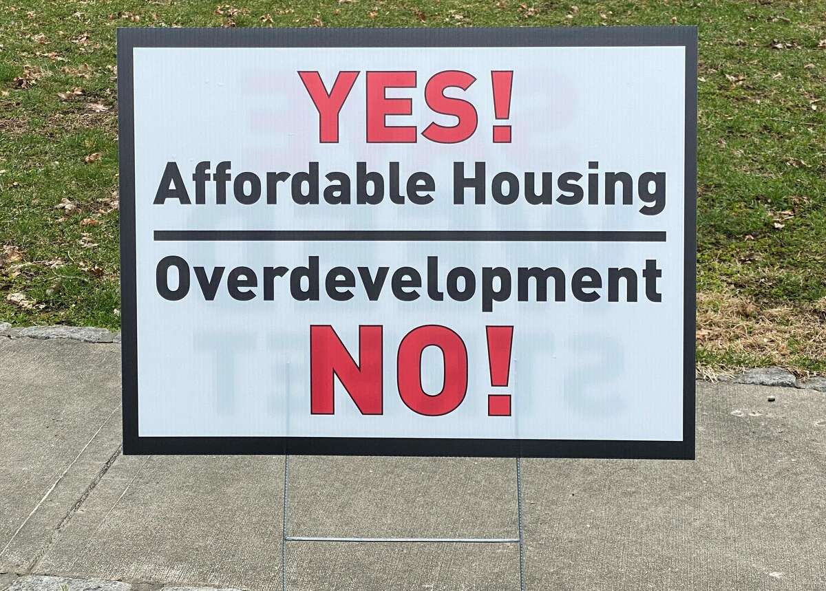 Signs opposed to the 8-30g development on 751 Weed Street on front lawns in New Canaan around town. 