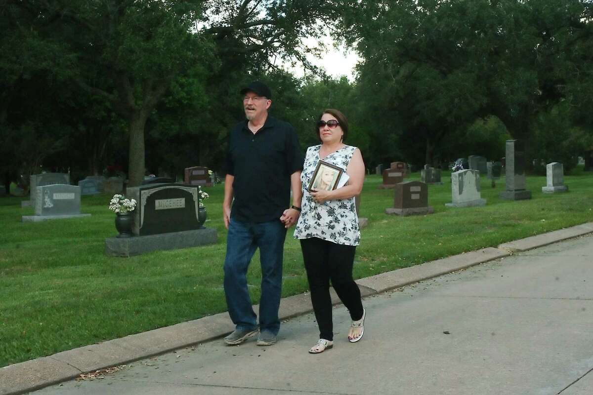 Michael and Shirley Kinchen walk along the planned route of the Savannah Memorial 5K fundraising walk in honor of their daughter Savannah, a victim of domestic violence. The event will be at Forest Park East Funeral Home and Cemetery Oct 1 in Webster.