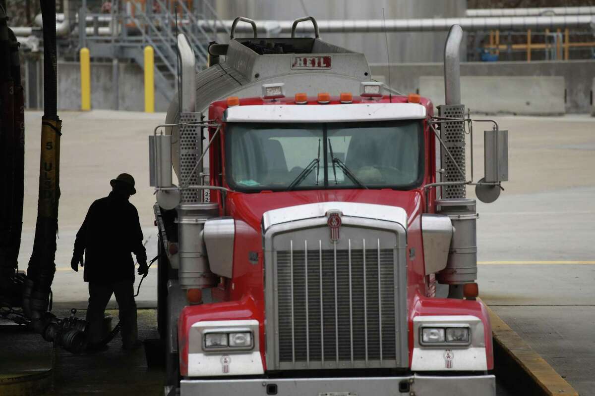 A worker refuels a gasoline tanker truck at the Valero Energy Corp. oil refinery terminal in Memphis, Tennessee, U.S., on Wednesday, Feb. 16, 2022. The U.S. and other major oil-consuming nations are considering releasing 70 million barrels of oil from their emergency stockpiles as crude prices surge amid growing concerns over supply after Russia invaded Ukraine. Photographer: Luke Sharrett/Bloomberg