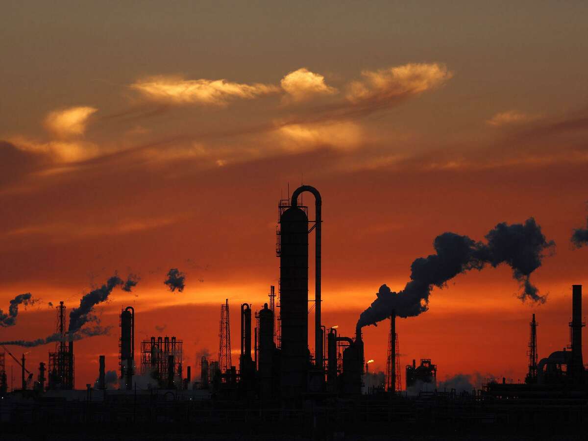 Emissions rise from an oil refinery at sunset in Texas City, Texas, on Feb. 16, 2017. MUST CREDIT: Bloomberg photo by Luke Sharrett.