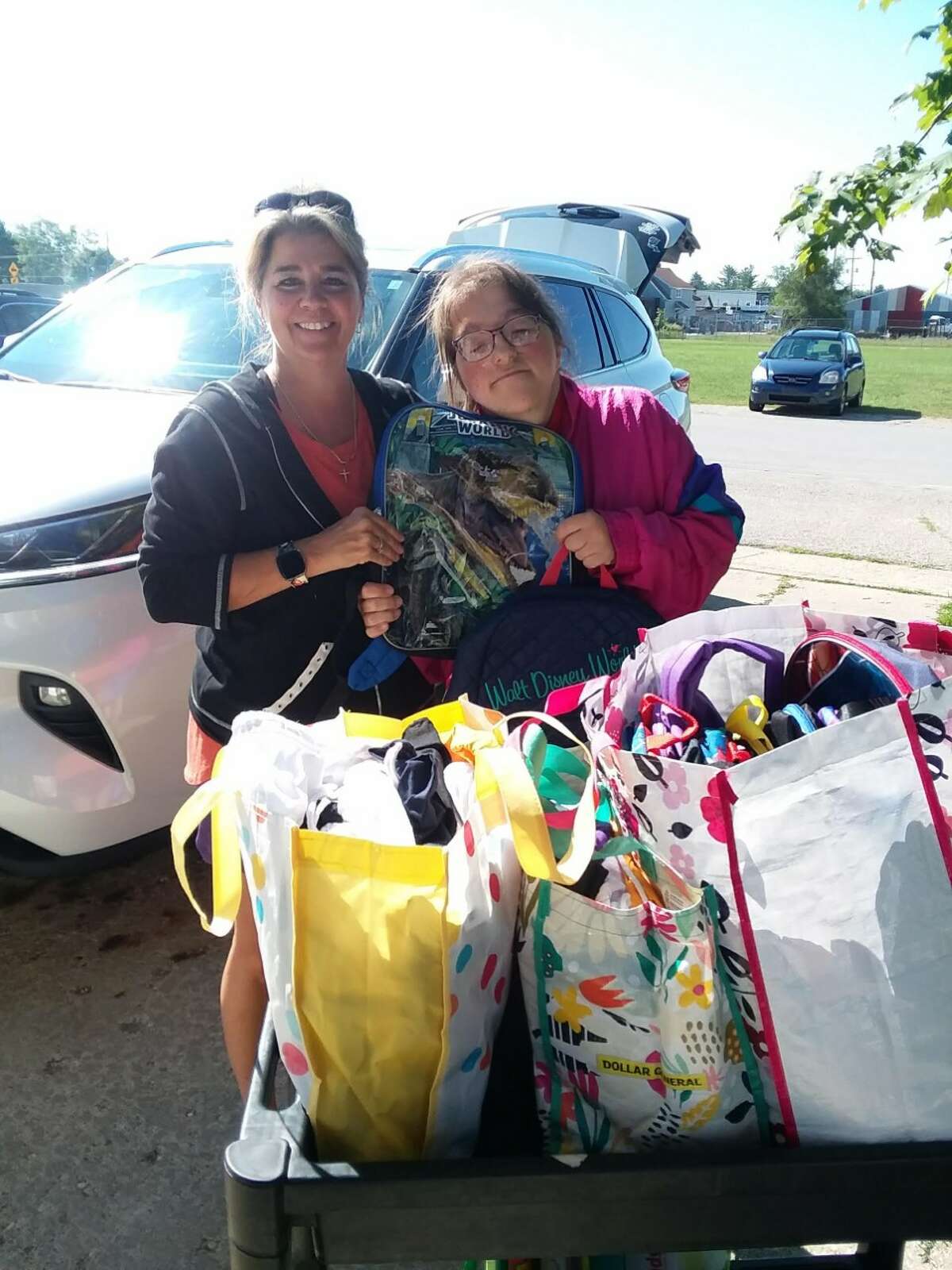 Renae and Ashley Walker donated book bags and back packs for kids in need for the start of school, again this year.  