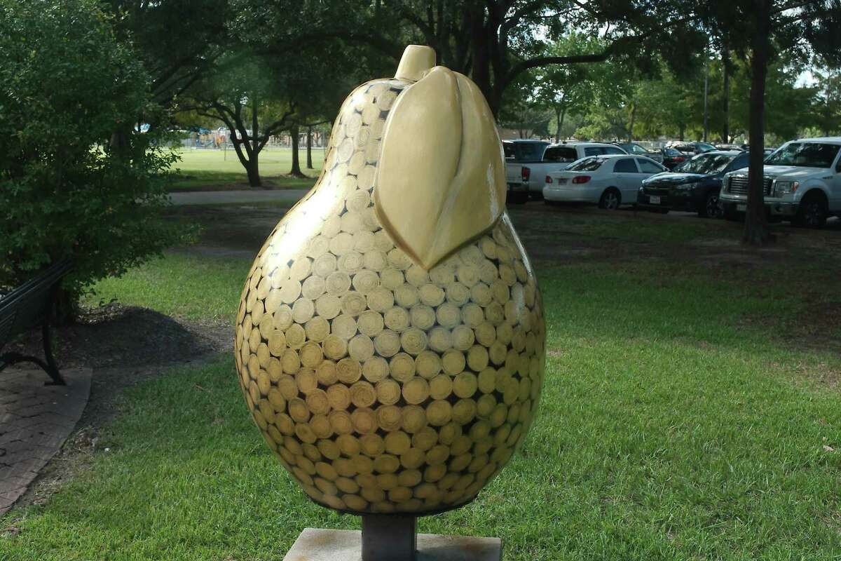 The "Swirls of Gold" pear sculpture stands near the David and Frankie Smith Family Foundation fountain and gazebo off Liberty Drive as part of the Pear-Scapes public art sculpture trail.