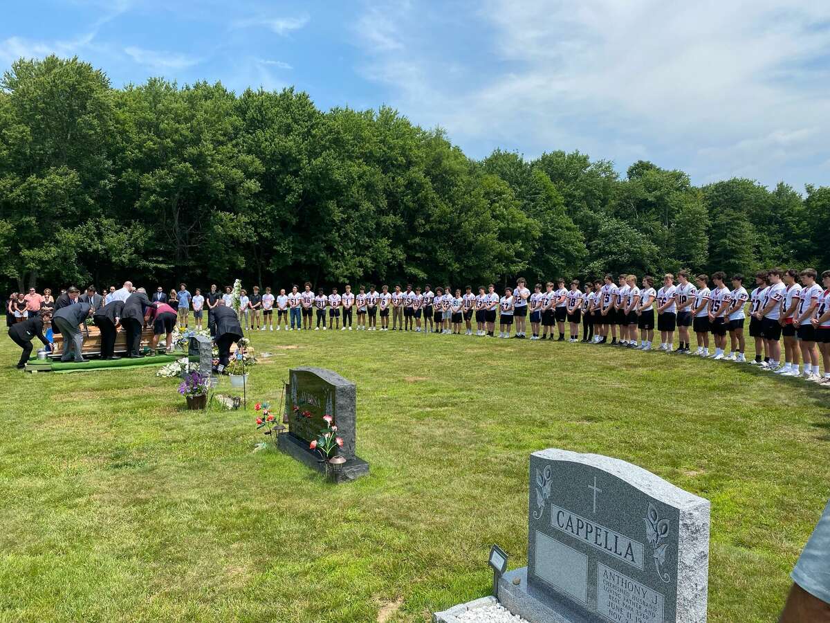 The Masuk football team attended the funeral of Cathy Christy in June wearing their uniforms.