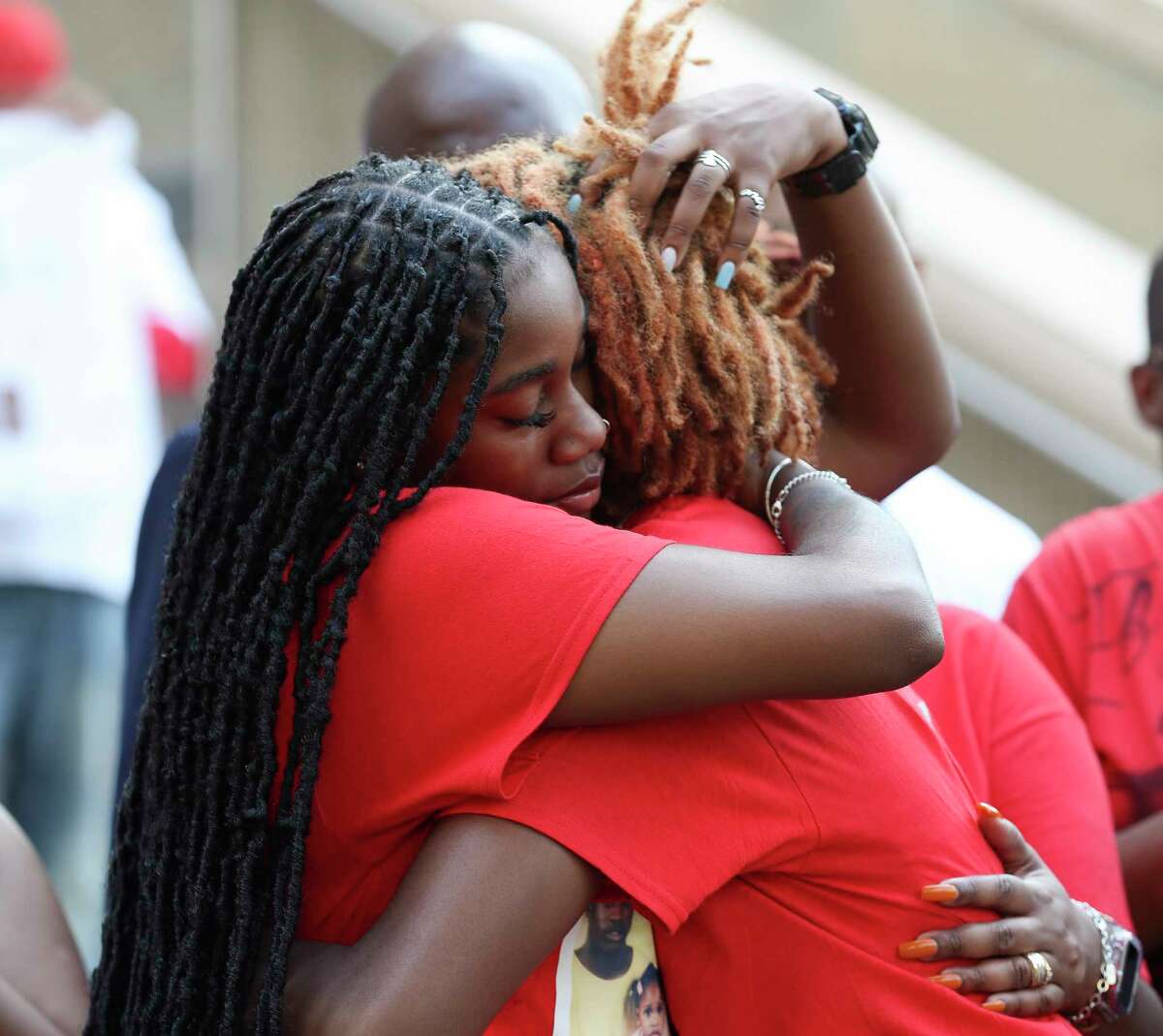 Aeenike Thomas, left, hugs her sister, Malikiya, after speaking about the death of their father, Danny Ray Thomas, during Rally for Justice to raise awareness of police violence in Houston and Harris County in front of the Harris County Civil Courthouse, Tuesday, Sept. 20, 2022, in Houston. Thomas, was shot and killed by a Harris County Sheriff's Office deputy in March of 2018.