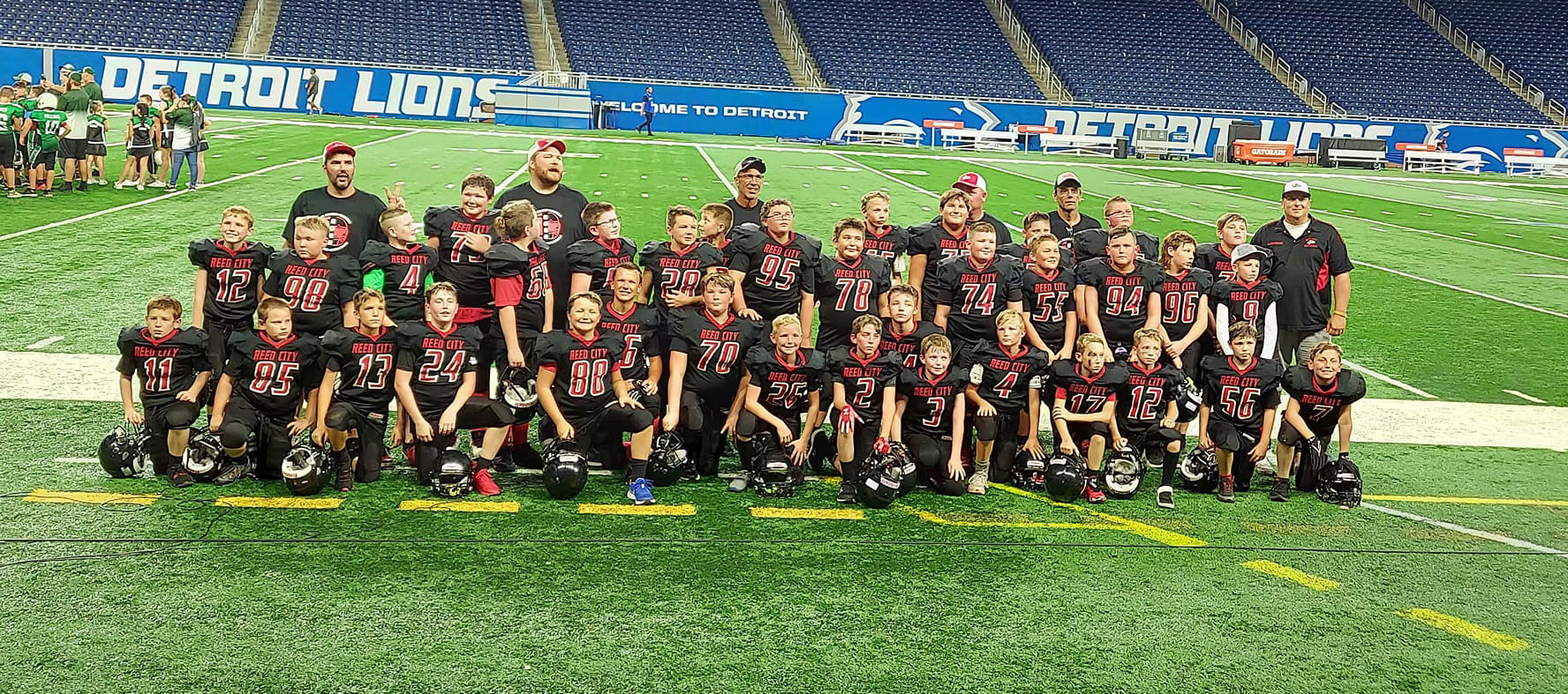 Reed City Rocket football players perform in Detroit