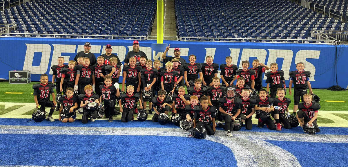 Reed City third and grade Rocket get players on Sunday get ready to perform at Ford Field.