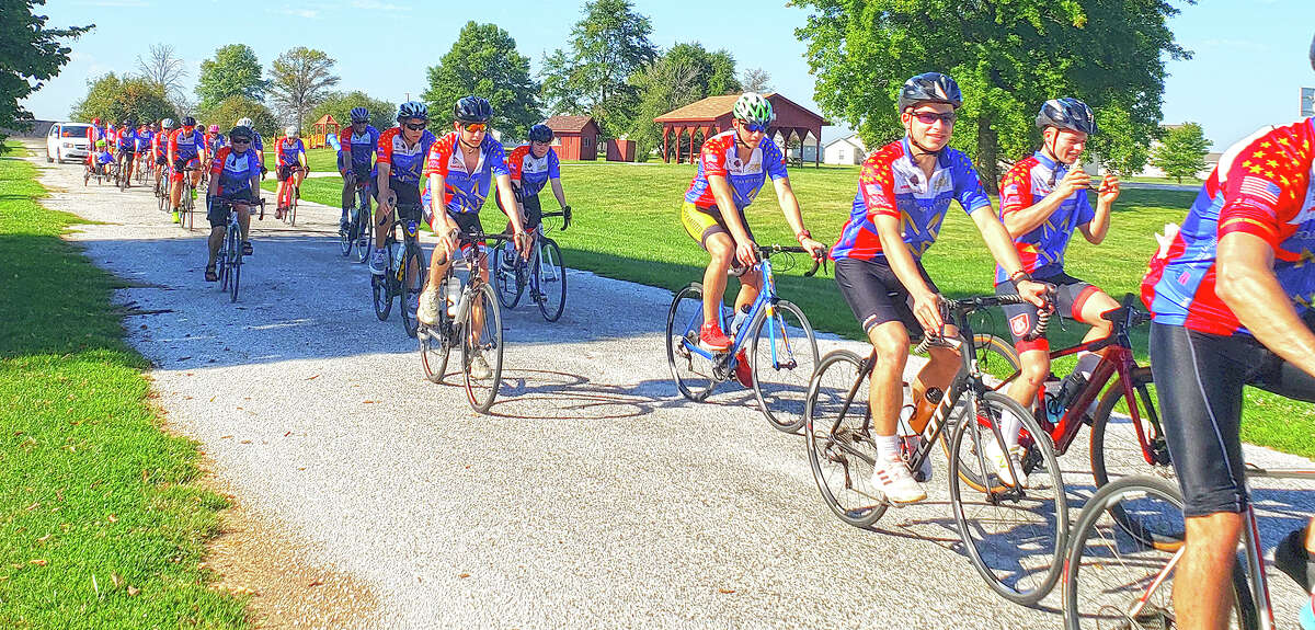 A line of bike riders makes its way across  Cass County.
