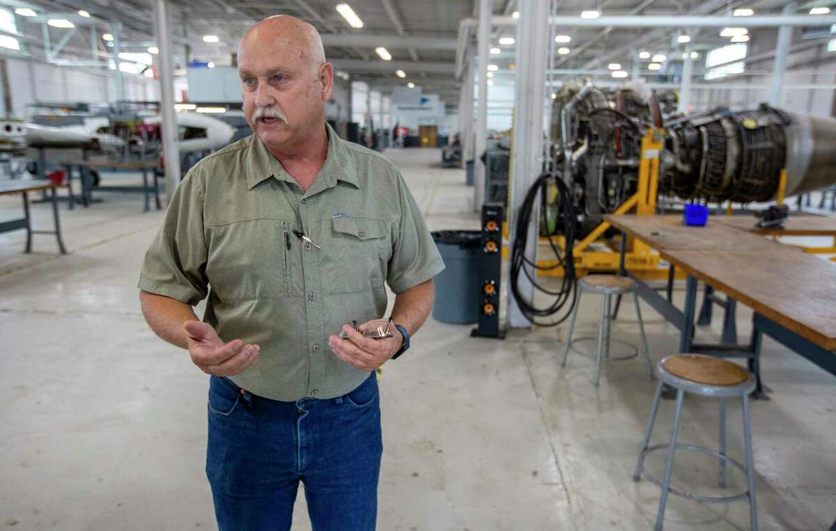 Larry Canion, St. Philips College's Aeronautical Engineering Program Director, speaks about the 19-month apprenticeship program in the hangar on the college's Southwest campus.