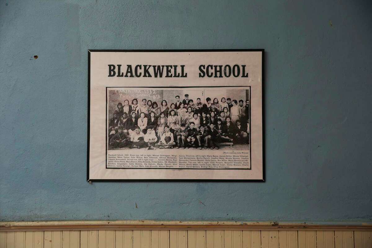 A vintage class photo of students from Blackwell School hangs on the wall in the only remaining school building in Marfa on Nov. 9, 2020. The school was open from 1909 until 1965, when it was shuttered during nationwide court-ordered desegregation.