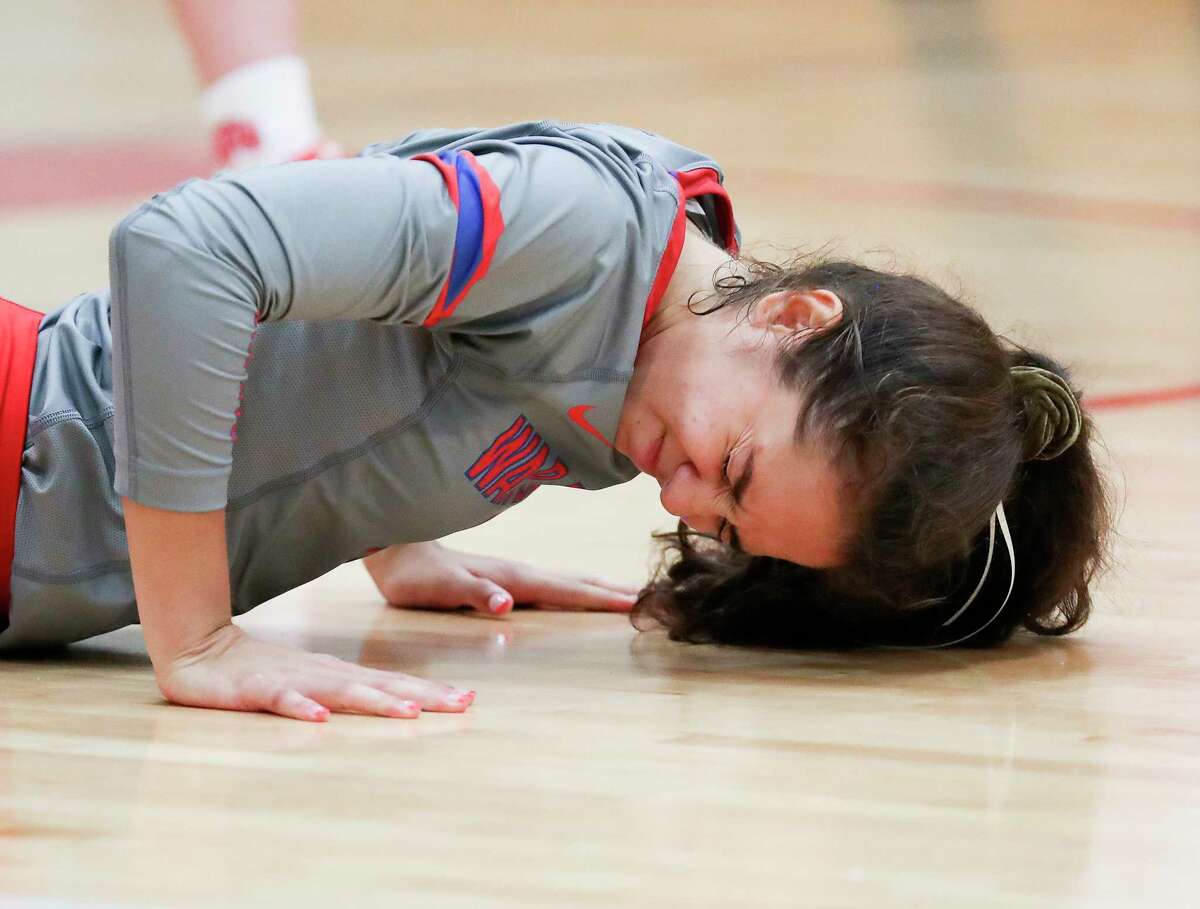 Oak Ridge's Lily Campos reacts after missing a serve by Caney Creek's Hailey Cabellero for an ace during the second set of a District 13-6A high school volleyball match at Caney Creek High School, Tuesday, Sept. 20, 2022, in Grangerland.