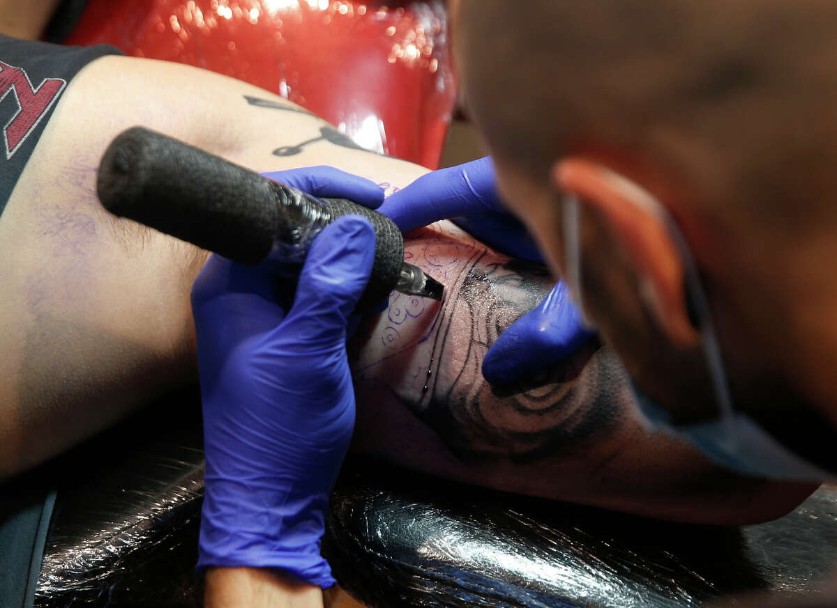 Tattoo artist Bruno Corvalan applies ink to Andrew Chang at Mission Ink Tattoo and Piercing Studio in San Francisco. Scientists are researching ways to use tattoo needles to administer drugs.