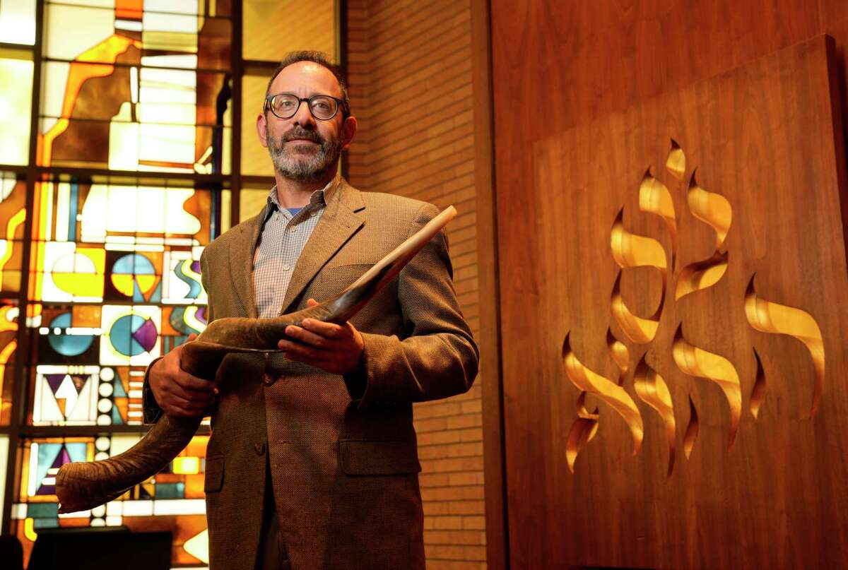 Rabbi Oren Hayon holds a shofar at Congregation Emanu El, 1500 Sunset Blvd., Tuesday, Sept. 13, 2022, in Houston.
