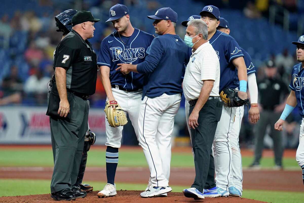 Tampa Bay Rays starting pitcher Shane McClanahan, second from left is taken out of the game against the Houston Astros during the fifth inning of a baseball game Tuesday, Sept. 20, 2022, in St. Petersburg, Fla.