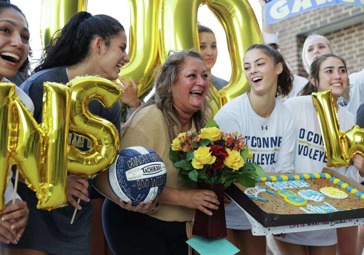 The O’Connor volleyball team celebrates Coach Yami Garcia’s 800th win after they defeated the fledgling volleyball team from Sotomayor in three straight games at Northside Gym on Tuesday, Sept. 20, 2022.