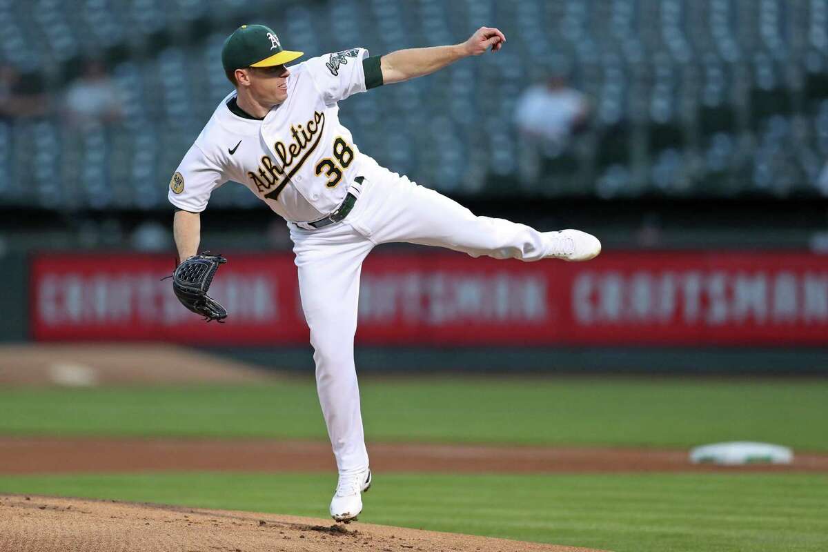 Oakland Athletics’ starting pitcher JP Sears follows through on a 1st inning pitch against Seattle Mariners during MLB game at Oakland Coliseum in Oakland, Calif., on Tuesday, September 20, 2022.