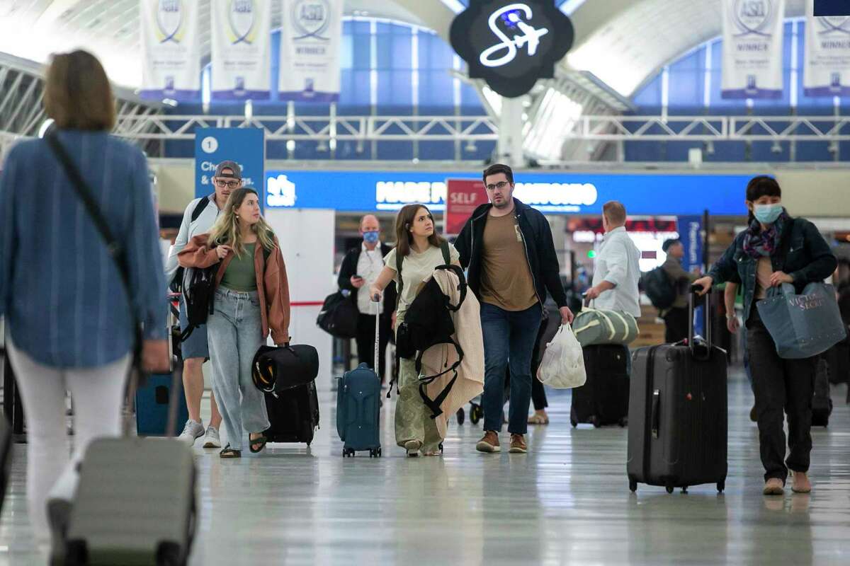 Travelers make their way through the San Antonio International Airport, which ranked ninth among large North American airports in this year’s J.D. Power customer satisfaction survey.
