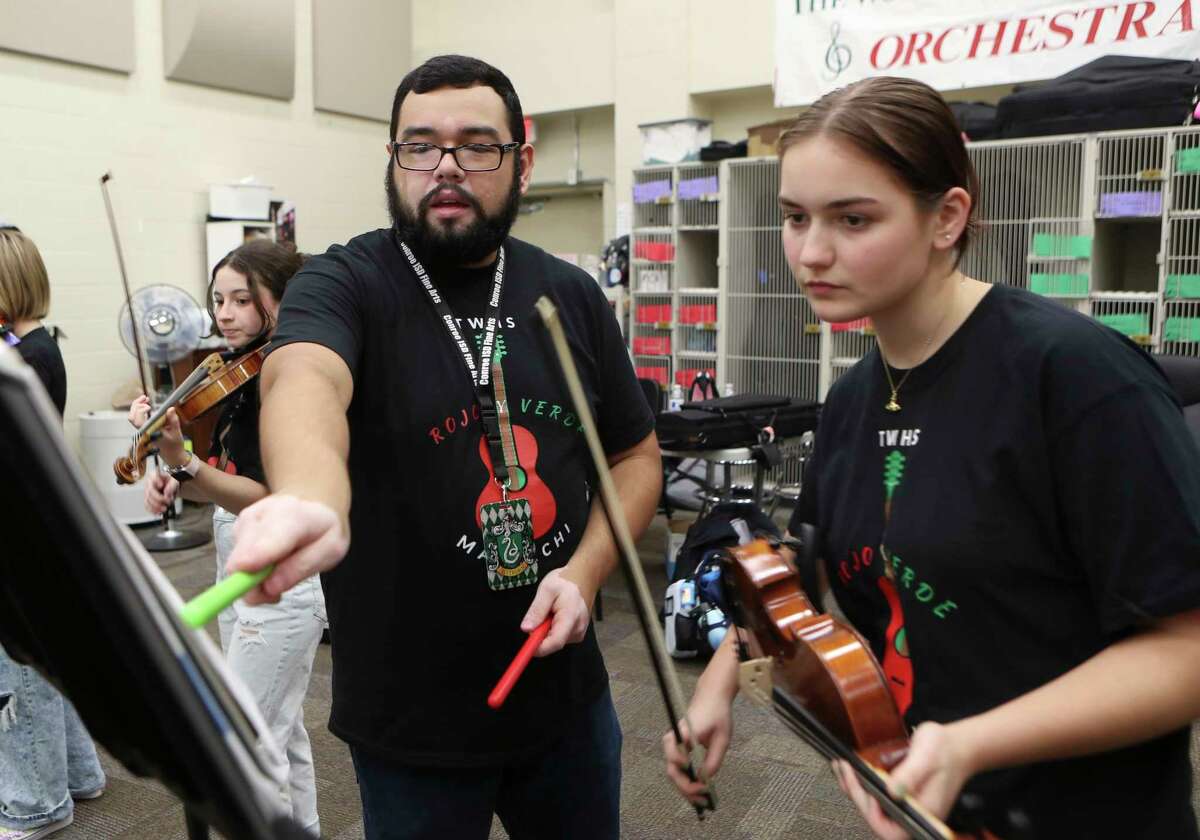 Assistant Orchestra Director Christian Ponce works with students during mariachi practice at The Woodlands High School, Friday, Sept. 16, 2022, in The Woodlands.