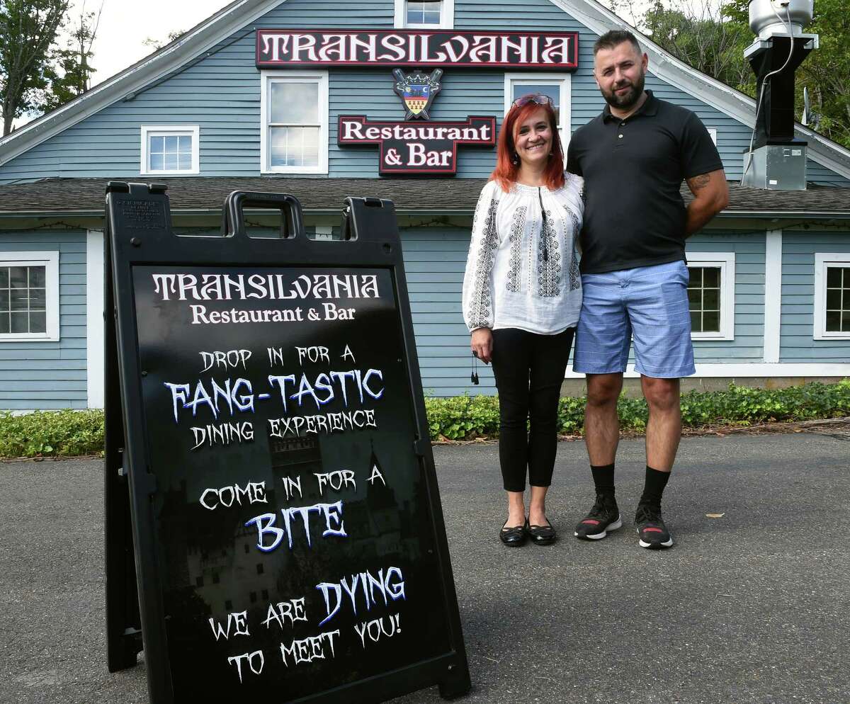 Alina Caldarariu and her husband, Chris, photographed in front of their soon to open Transilvania Restaurant & Bar on Main Street in East Haven on September 21, 2022.