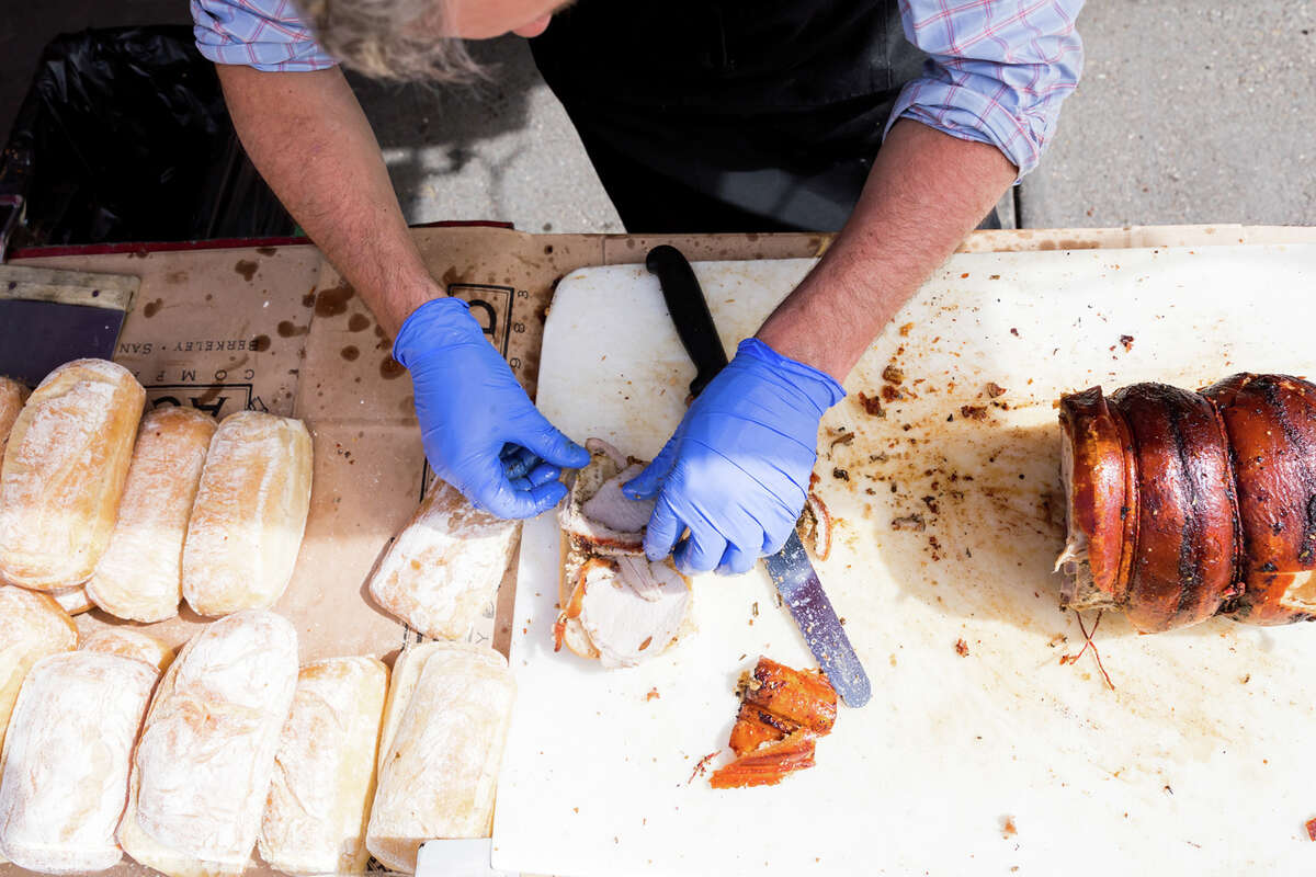 Thomas Odermatt assembing a porchetta sandwich at the Roli Roti food truck at the Ferry Building in San Francisco, Calif. on Sept.
/p
p20, 2022.