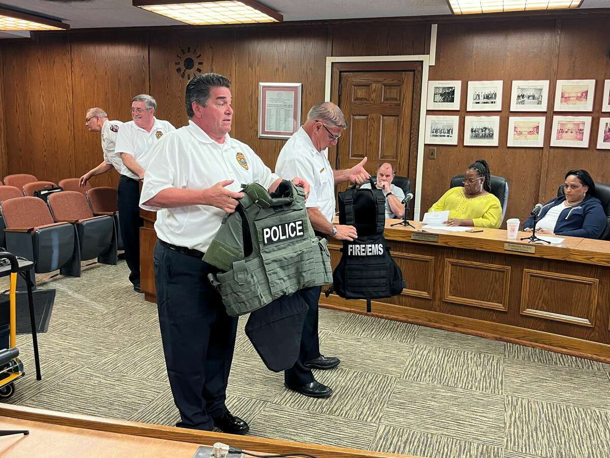 West Haven fire officials demonstrate the differences in ballistic fire vest equipment to the City Council on Sept. 20, 2022.