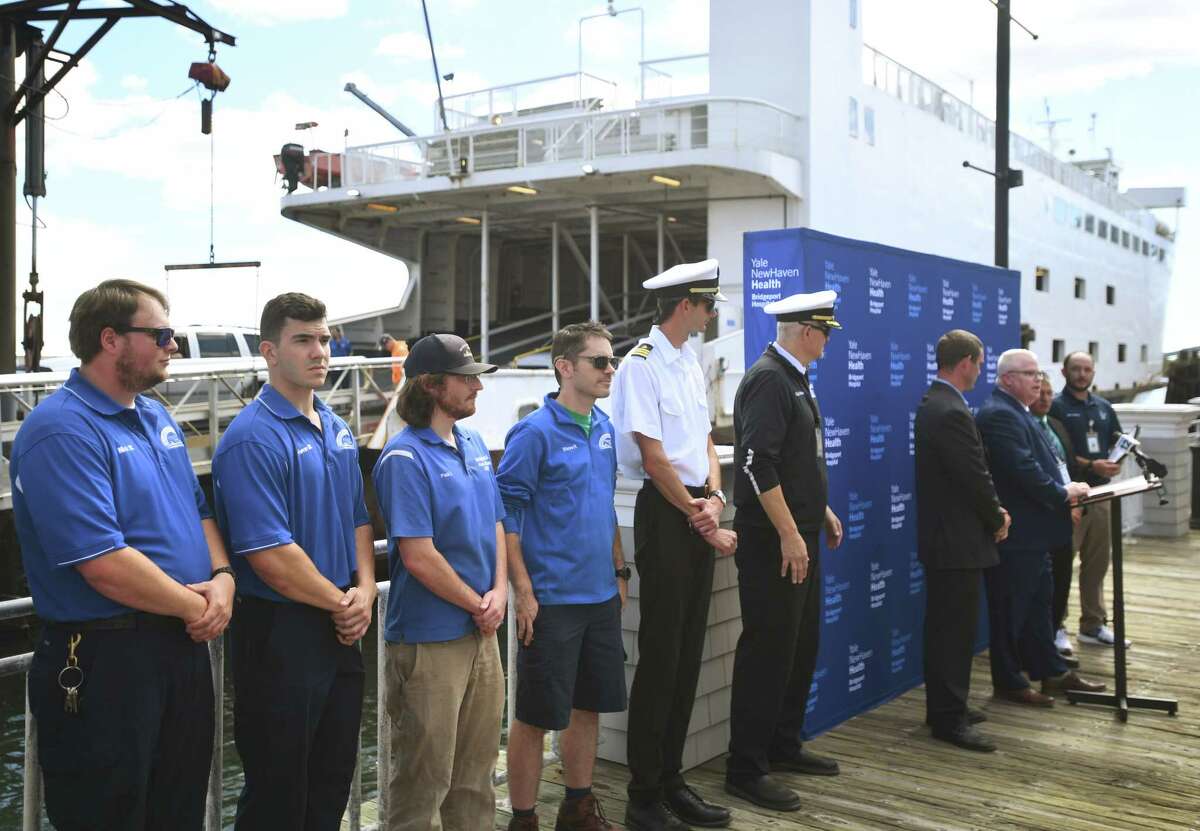 Bridgeport-Port Jefferson Ferry crew members are honored in a ceremony at the ferry terminal in Bridgeport, Conn. on Wednesday, September 21, 2022. Customer Paul Havran, of St. James, NY, had a heart attack during a ferry crossing and was saved through quick action by the crew, an off duty firefighter on board, and quick transport to Bridgeport Hospital.