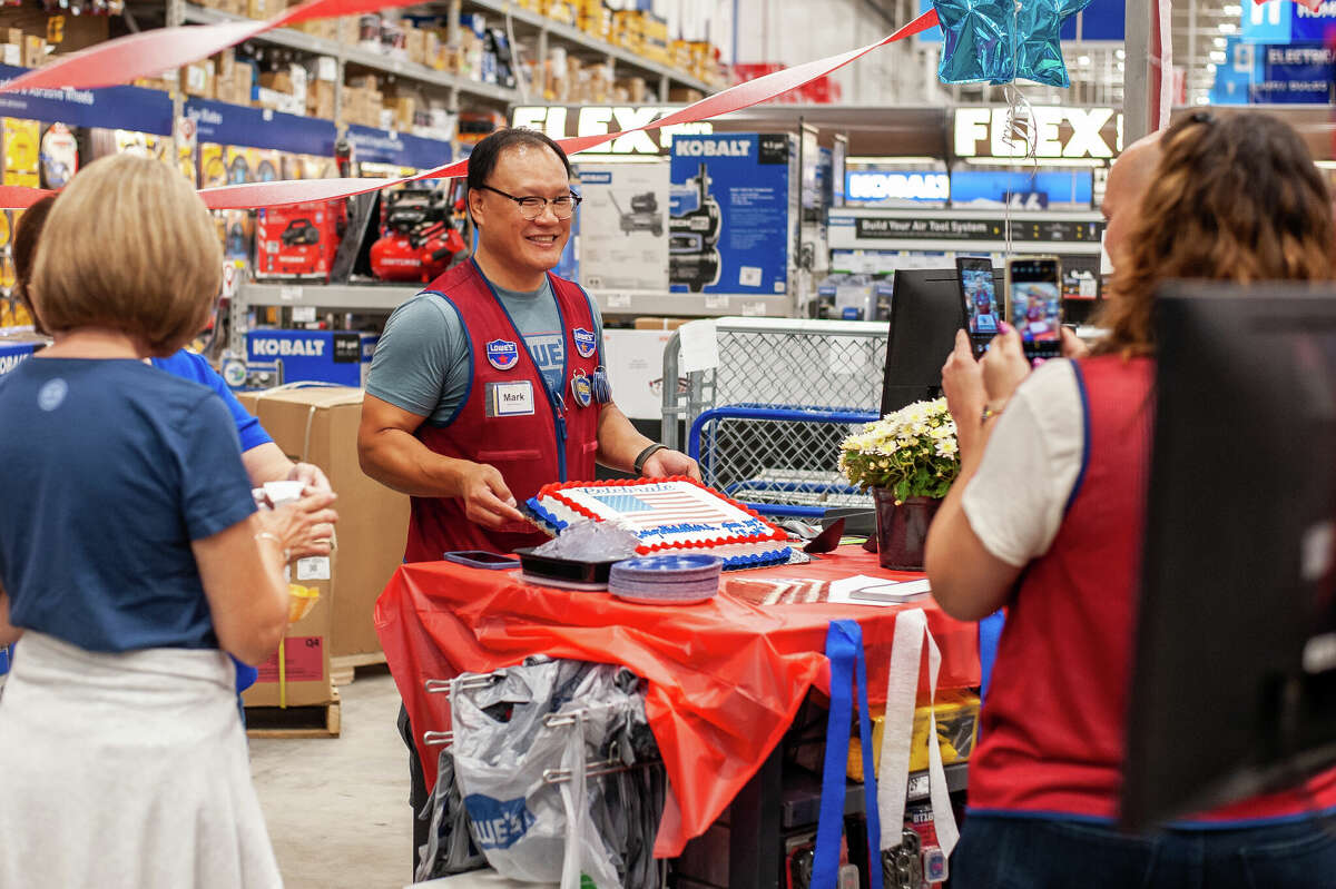 Midland resident Mark Xu Jian celebrates becoming a U.S. citizen with his co-workers on Sept 21, 2022 at the Midland Lowe's, where he has worked for eight and a half years.