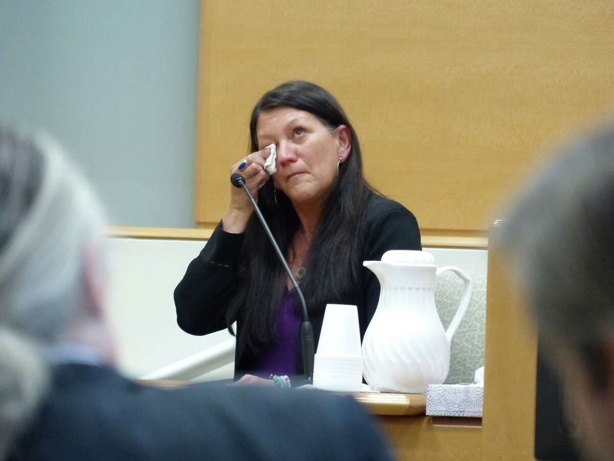 Jennifer Hensel wipes away a tear as she testifies during the Alex Jones Sandy Hook defamation damages trial at Connecticut Superior Court in Waterbury, Conn. Wednesday, Sept. 21, 2022. Hensel's daughter Avielle Rose Richman was killed during the Sandy Hook Elementary School shooting in 2012.