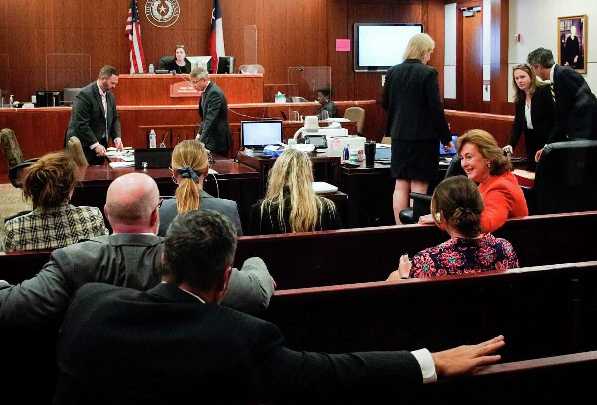 Harris County District Attorney Kim Ogg, third from right, waits for a hearing in the 263rd District Criminal Court on Wednesday, Sept. 21, 2022, at the Harris County Criminal Courthouse in Houston. Alex Guajardo’s attorneys are seeking to move his trial because of publicity around his case and efforts to reform bail practices in the county. Guajardo is accused of stabbing Caitlynne Guajardo to death in August 2019 at their Pasadena home, days after she withdrew her attempt to divorce him. He was free on a personal recognizance bond at the time of her death.
