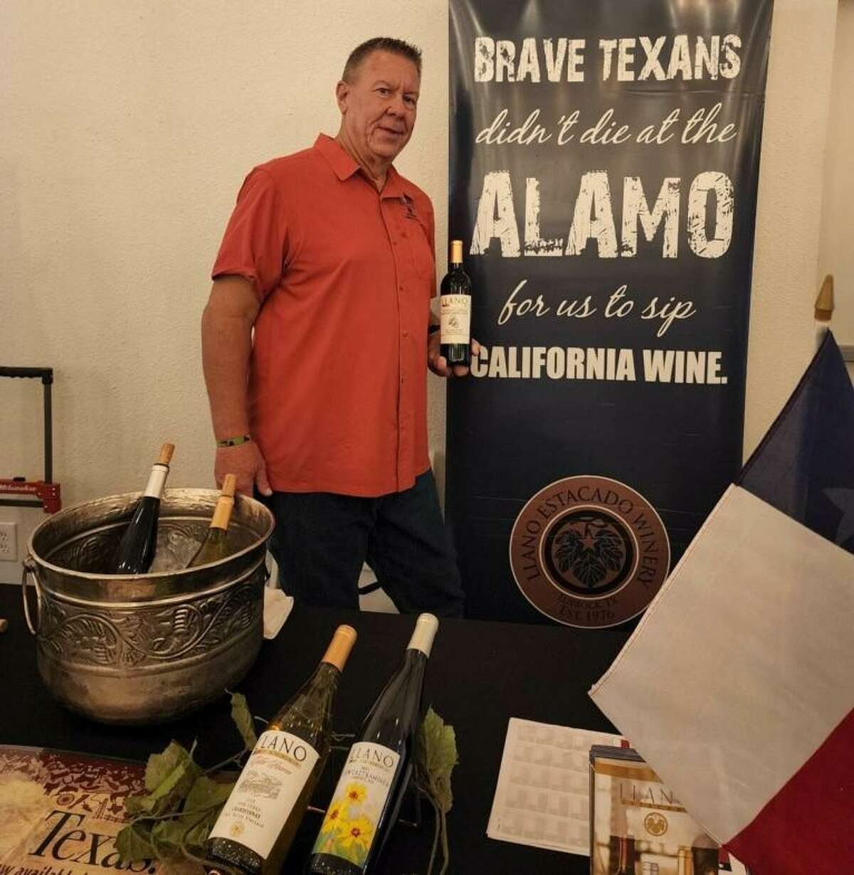 Bill Freidhof is pictured with Llano Estacado wine during a charity wine event for Bridgewood Farms on Saturday.