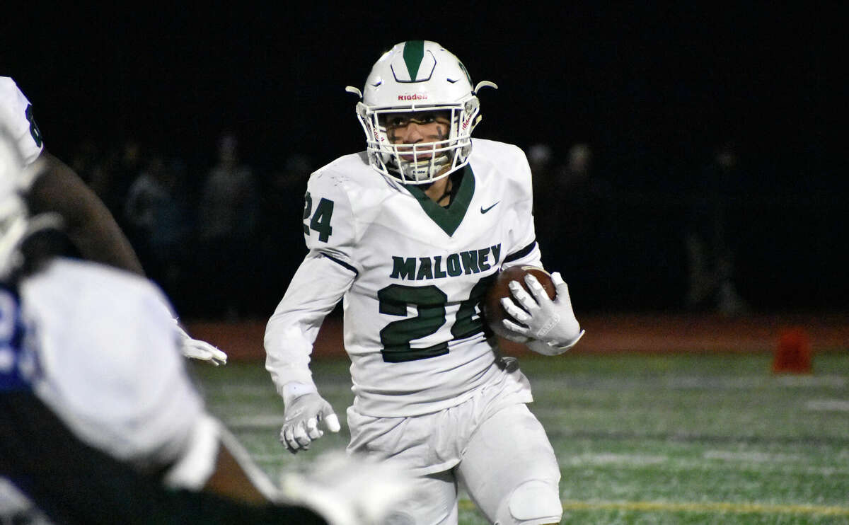 Maloney running back Josh Boganski runs the ball in a football game between Maloney and Hall at Hall High School, West Hartford on Friday, Nov. 5, 2021.