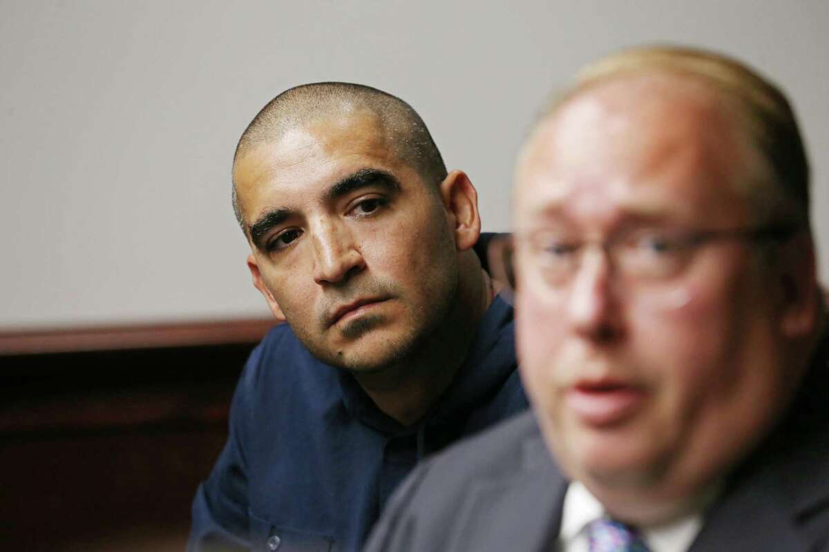 Hector Bribiescas, left, the father of London Sophia Bribiescas, a 10-year-old child killed nearly four years ago, listens as attorney Joseph Hoelscher speaks with the media on Monday, Sept. 19, 2022. The child was found shot to death with her sister, Alexa Denice Montez, 16, and their mother, Nichol Leila Olsen, 37, at the Anaqua Springs Ranch home of Charles Edward Wheeler, who was Olsen’s boyfriend. 