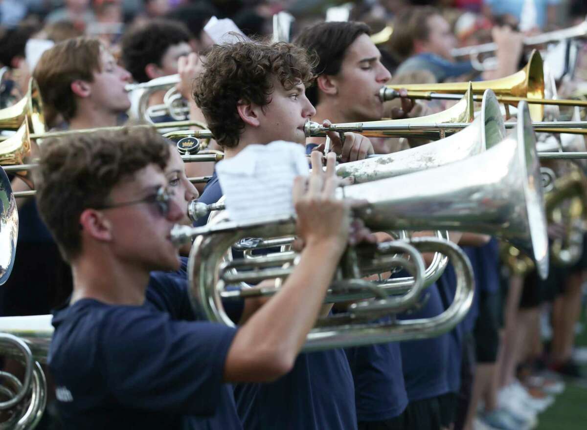 Members of the College Park High School band perform during the school’s homecoming parade at Market Street, Tuesday, Sept. 21, 2022, in The Woodlands.