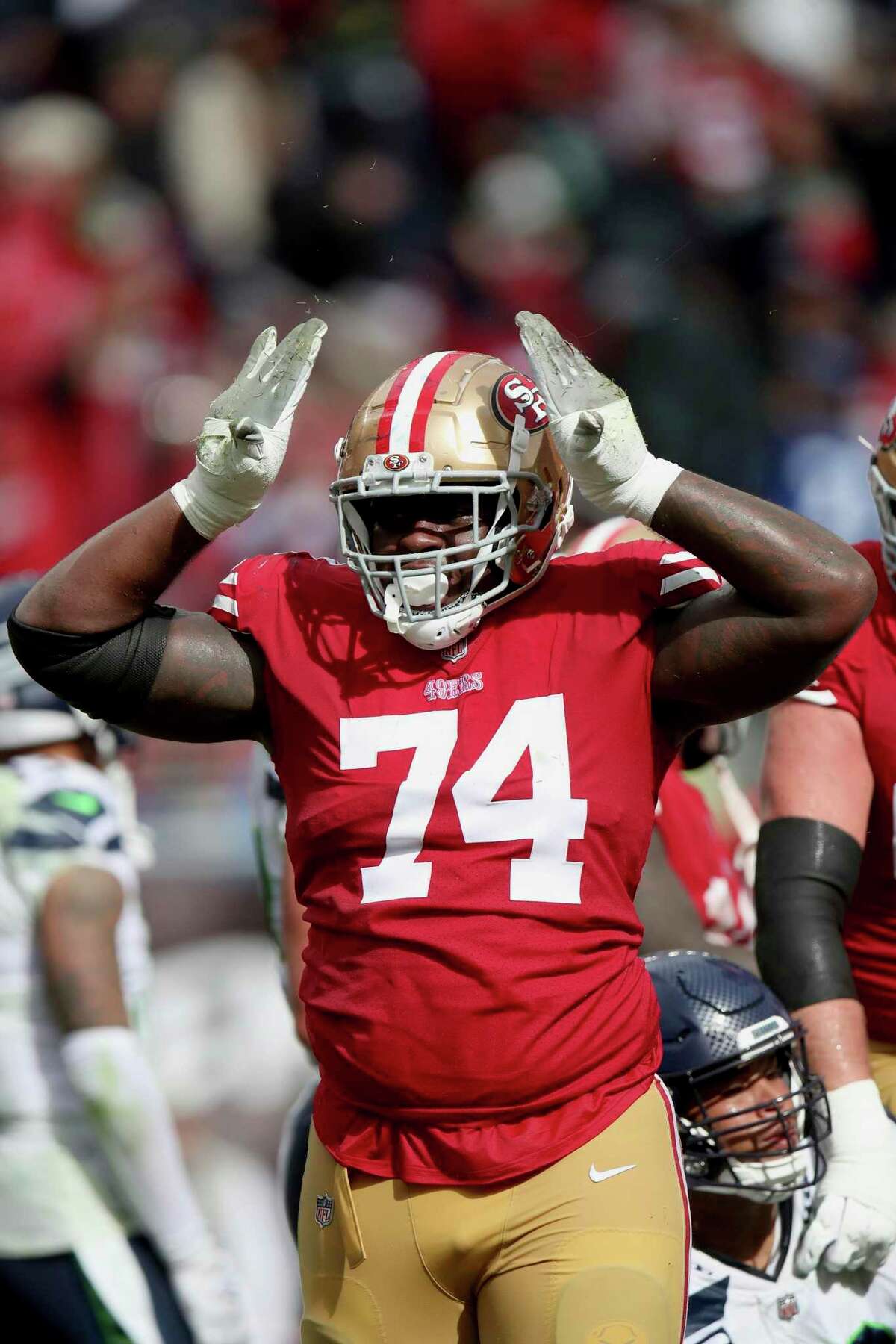 San Francisco 49ers offensive tackle Spencer Burford (74) reacts