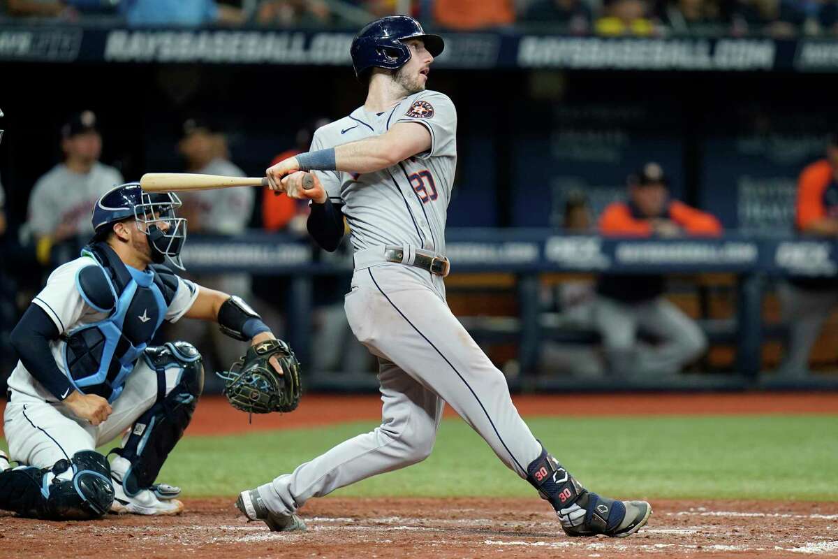 Houston Astros' Kyle Tucker (30) watches his two-run home run off Tampa Bay Rays relief pitcher Brooks Raley during the eighth inning of a baseball game Wednesday, Sept. 21, 2022, in St. Petersburg, Fla. Catching for the Rays is Rene Pinto.