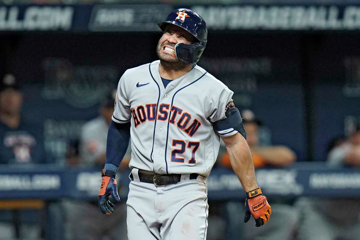 Houston Astros' Jose Altuve grimaces in pain after getting hit by a pitch from Tampa Bay Rays starting pitcher Corey Kluber during the fifth inning of a baseball game Wednesday, Sept. 21, 2022, in St. Petersburg, Fla. Altuve remained in the game.