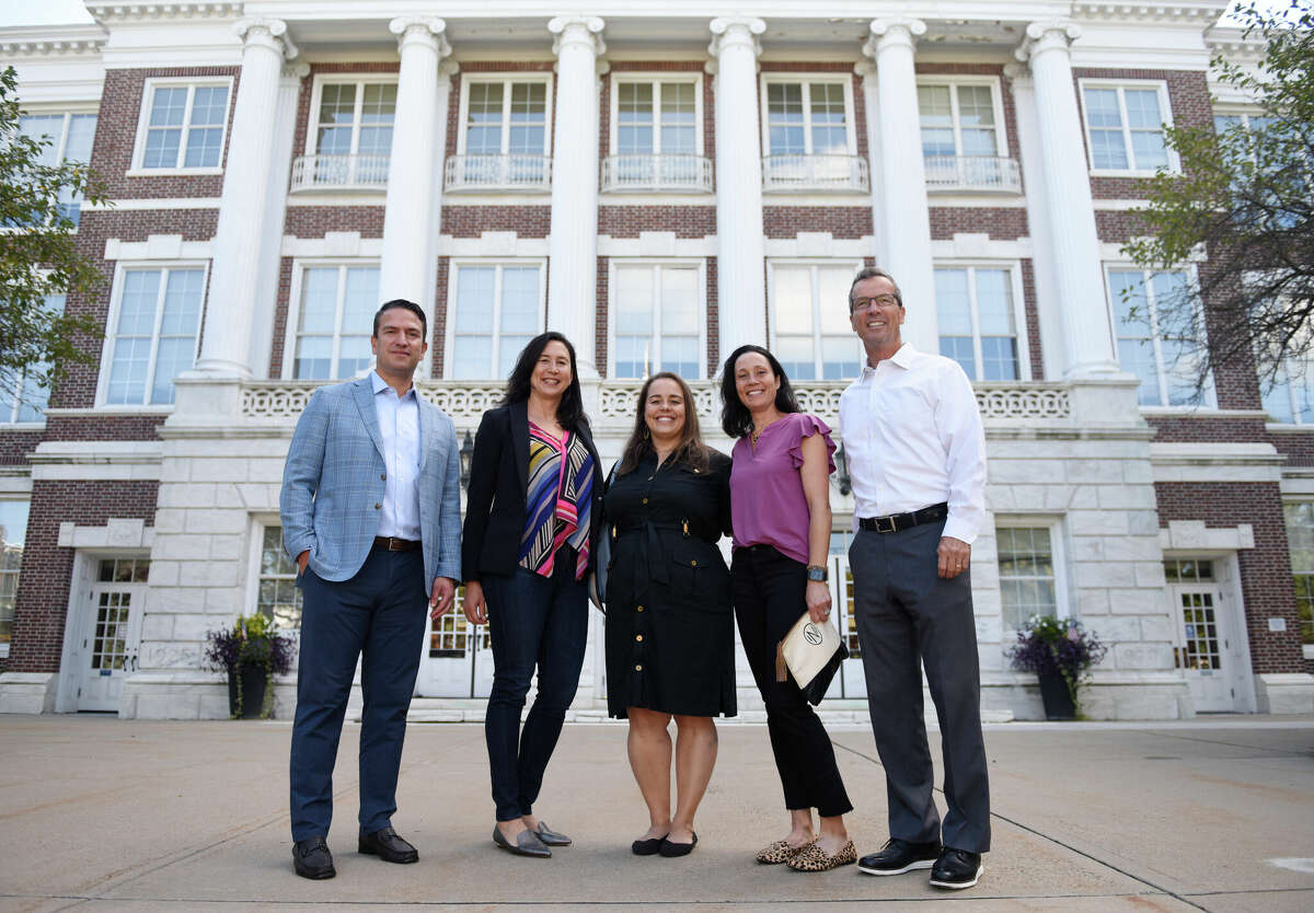 From left, Greenwich United Way Board Chair Mario Forlini, board member Karin McShane, board member Grace Djuranovic, board member Nicole Kwasniewski, and CEO David Rabin speaks about the annual fundraising kickoff outside Town Hall in Greenwich, Conn. Wednesday, Sept. 21, 2022.
