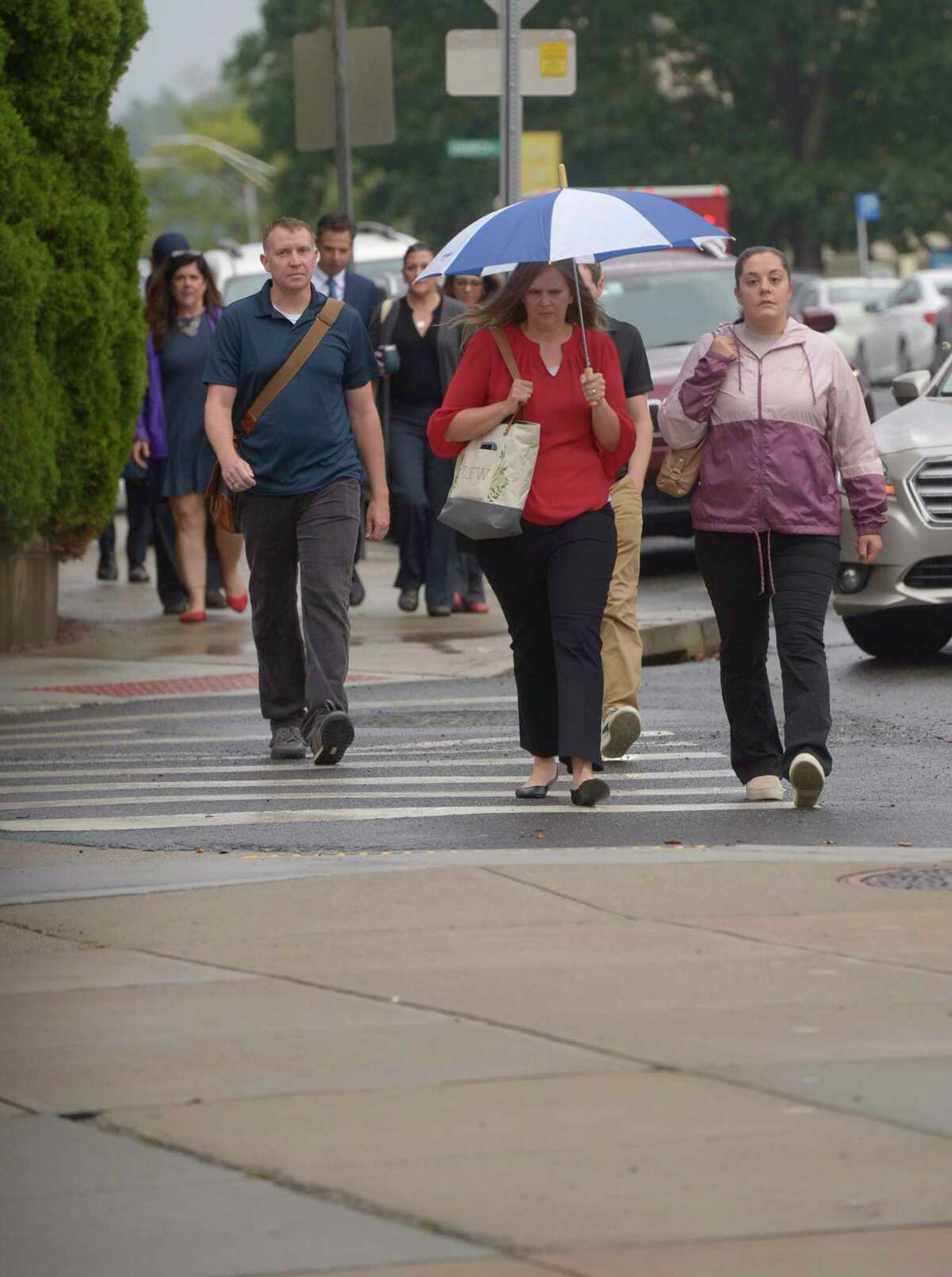 Family members walk to Superior Court in Waterbury for the defamation damages trial with Alex Jones. Thursday morning, September 22, 2022, Waterbury, Conn.