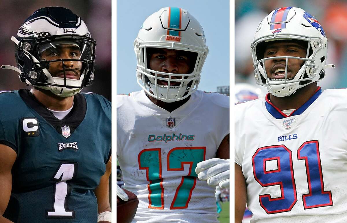 Eagles quarterback Jalen Hurts (left), Dolphins receiver Jaylen Waddle (center) and Bills defensive lineman Ed Oliver (right) all were high school stars in Houston before becoming making it to the NFL.