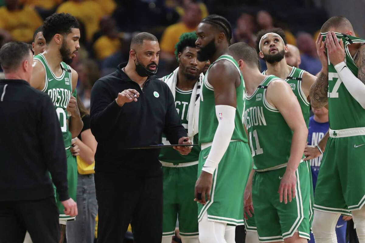 FILE - Boston Celtics head coach Ime Udoka, center left, talks with players during the first half of Game 2 of basketball's NBA Finals against the Golden State Warriors in San Francisco, Sunday, June 5, 2022. The Boston Celtics are planning to discipline coach Ime Udoka, likely with a suspension, because of an improper relationship with a member of the organization, two people with knowledge of the matter told The Associated Press on Thursday, Sept. 22, 2022.