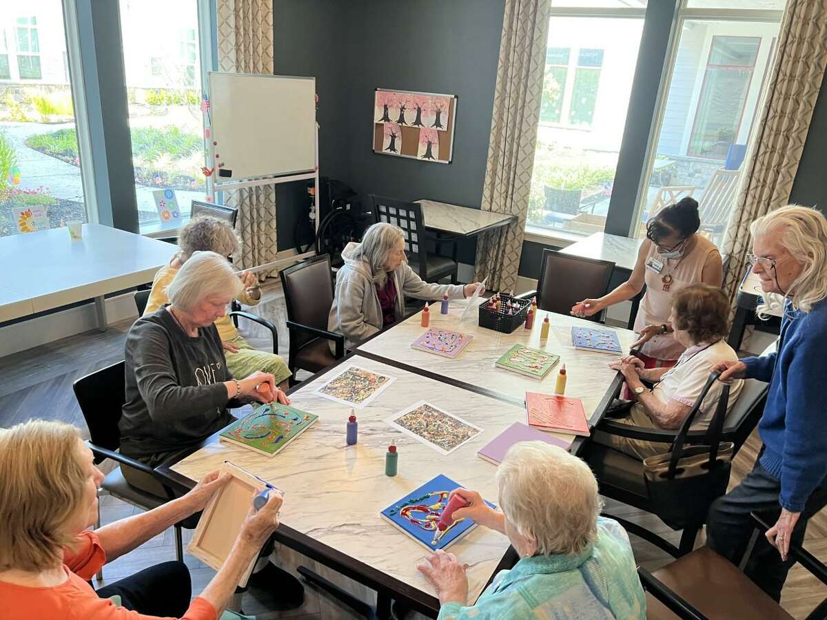 Ridgefield Station Senior Living Community residents recently engaged in an artist Jackson Pollock-inspired painting class.