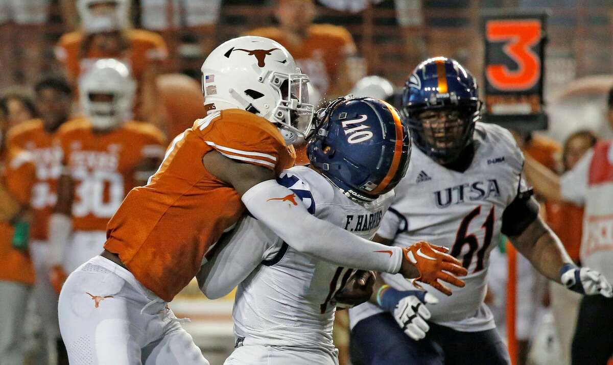 UTSA Roadrunners quarterback Frank Harris (0) takes a helmet to helmet from Texas linebacker DeMarvion Overshown (0) in second half action on Saturday, Sept. 17, 2022 at Darrell K Royal Memorial Stadium. Texas defeated UTSA 41-20