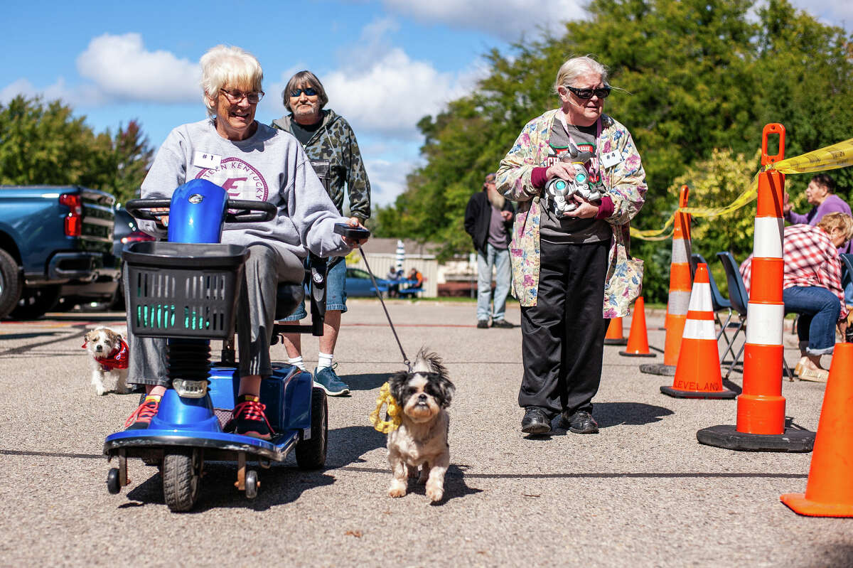 Cleveland Manor residents show their dogs at the Cleveland Manor Pet and Assist Animal Parade and Pageant on September 22, 2022 at Cleveland Manor in Midland.