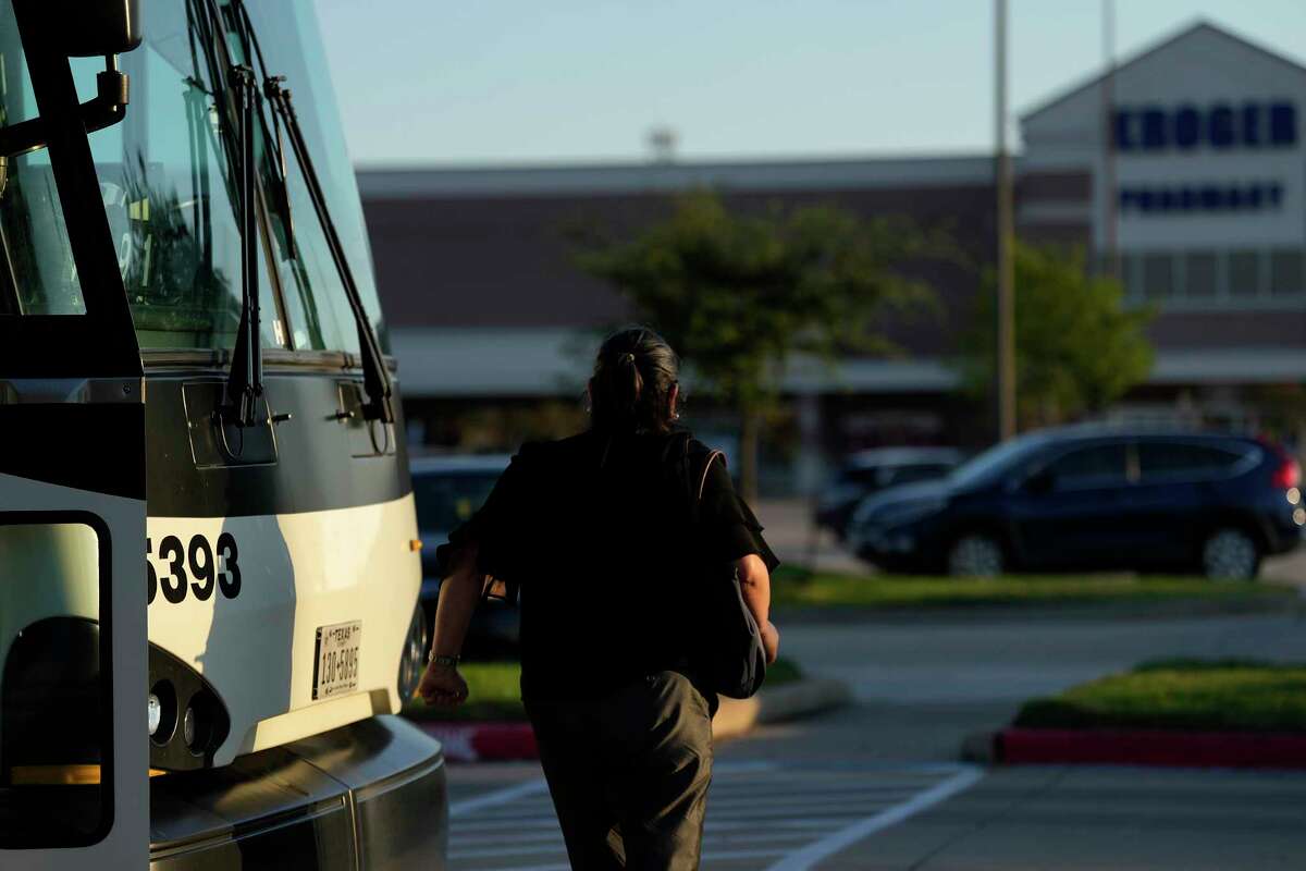 A Metropolitan Transit Authority commuter bus rider goes to her car at the Kroger parking lot after getting off the bus at the Missouri City park and ride stop on Wednesday, Sept. 21, 2022.