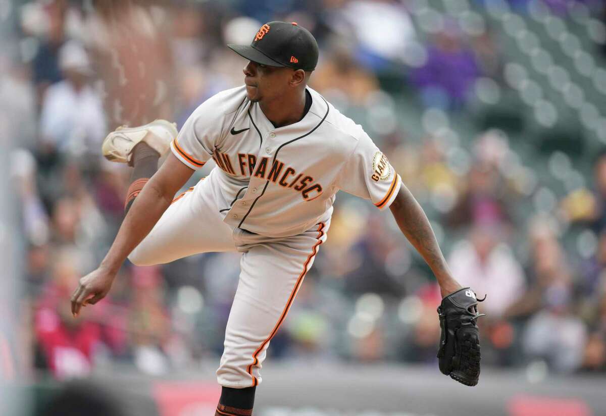 San Francisco Giants relief pitcher Jharel Cotton works against the Colorado Rockies in the fifth inning of a baseball game, Thursday, Sept. 22, 2022, in Denver. (AP Photo/David Zalubowski)