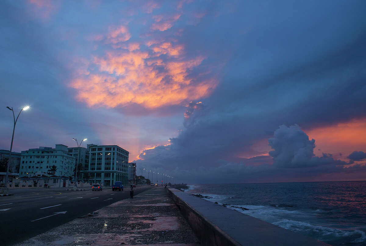 Stormy weather keeps people from the malecon at sunset in Havana, Cuba, in May 2015.