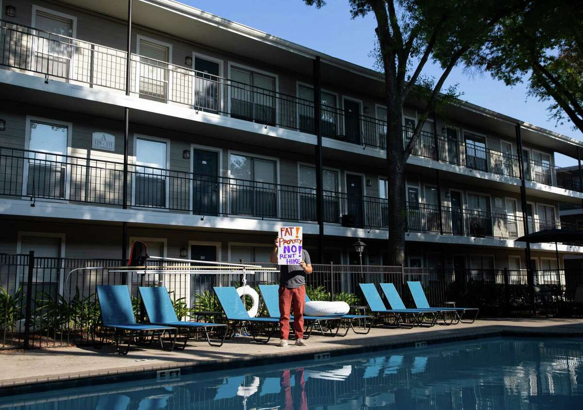 Alex Spike, tenant organizer with Houston Tenants Union and Socialist Alternative, poses for a photograph at his apartment complex.