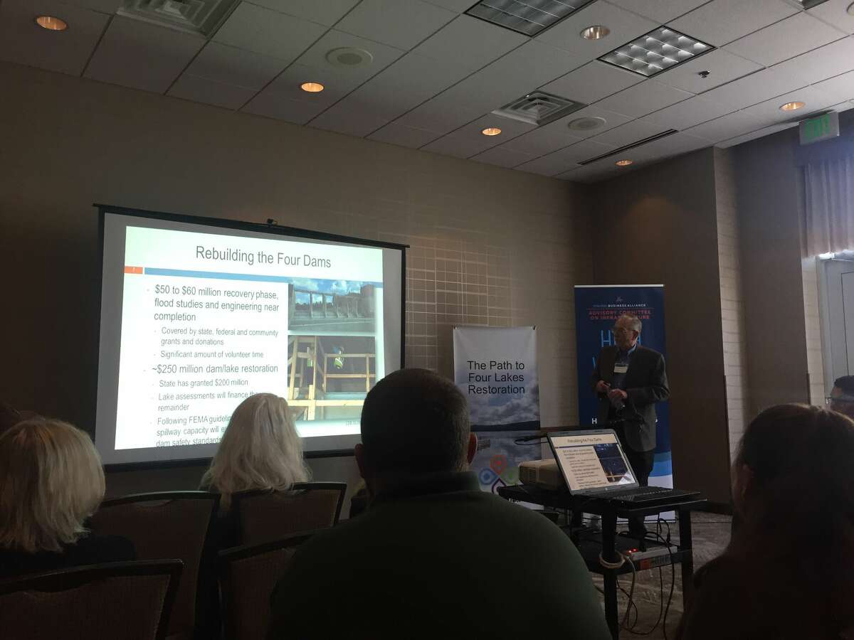 Four Lakes Task Force Vice-President Dave Rothman, right, presents on the topic "The Path to Four Lakes Restoration" during the Saginaw Bay Watershed Initiative's 2022 State of the Bay Conference at the Doubletree Hotel and Conference Center on Thursday in Bay City. 