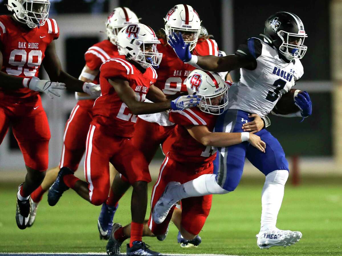 New Caney running back Kedrick Reescano (3) runs for a 26-yard gain in the second quarter of a District 13-6A high school football game at Woodforest Bank Stadium, Thursday, Sept. 22, 2022, in Shenandoah.